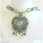 Green Multi Stranded Necklace Holding Traditional Heart Pendant w/ Dangling Beads Necklace